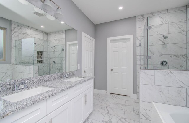 bathroom featuring vanity and separate shower and tub