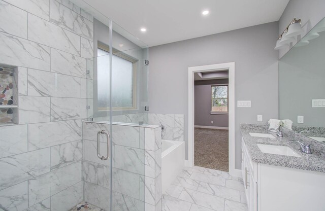 bathroom featuring vanity and shower with separate bathtub