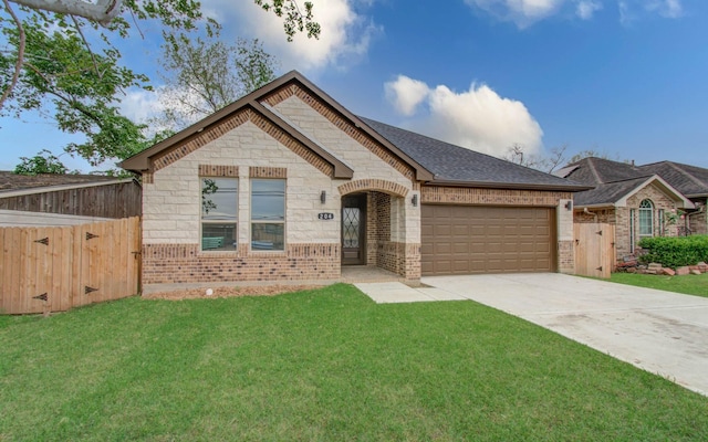 view of front facade with a garage and a front lawn