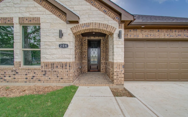 doorway to property featuring a garage