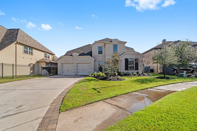 view of front facade featuring a front yard and a garage