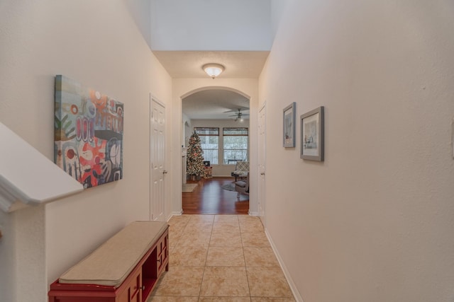 hall with light tile patterned flooring