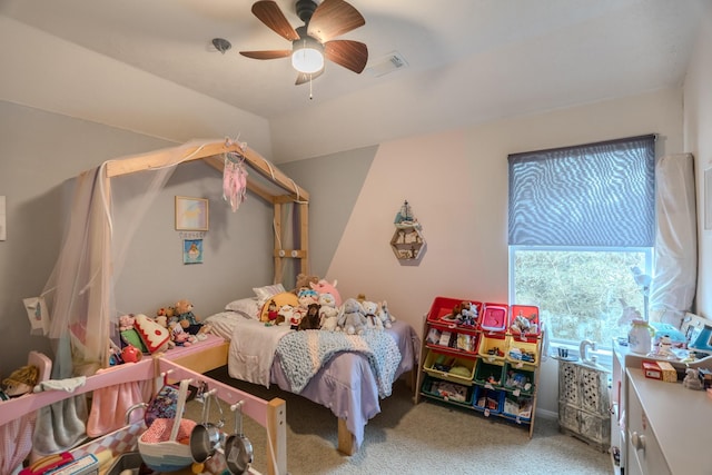 bedroom with ceiling fan, carpet floors, and lofted ceiling