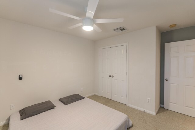 bedroom featuring carpet flooring, a closet, and ceiling fan