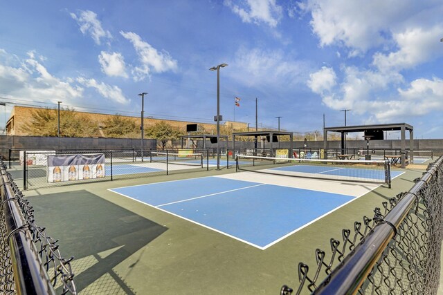 view of sport court with basketball hoop