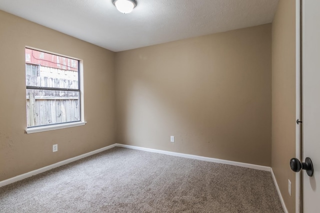 empty room featuring carpet flooring