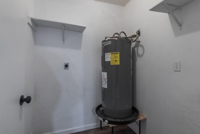 utility room featuring water heater