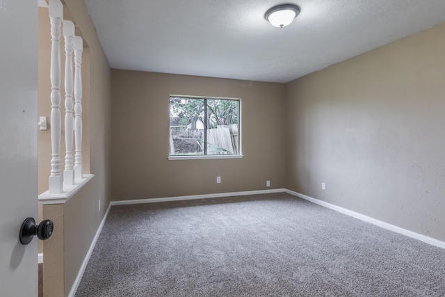 unfurnished room with carpet flooring