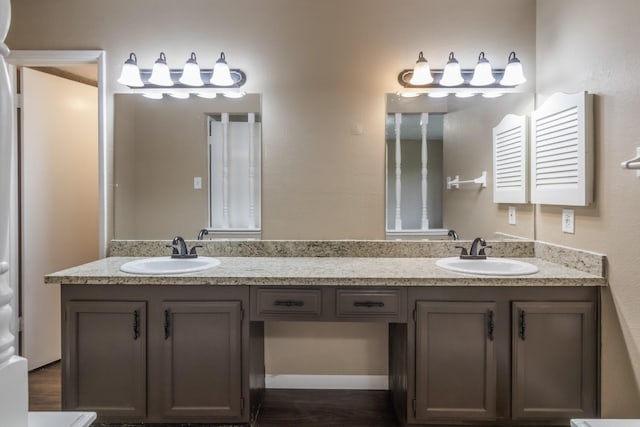 bathroom featuring hardwood / wood-style flooring and vanity