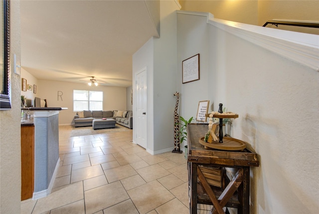 hallway featuring light tile patterned floors