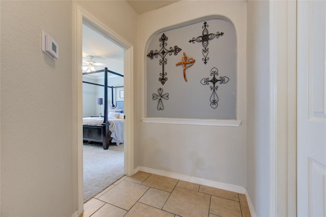 corridor featuring light tile patterned flooring