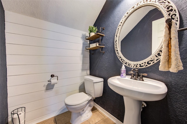 bathroom with tile patterned flooring and toilet