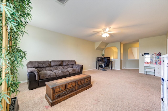 carpeted living room featuring ceiling fan