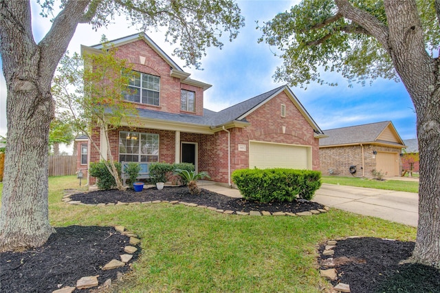 front of property featuring a garage and a front lawn