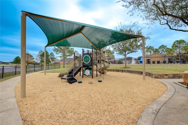 view of jungle gym featuring a lawn