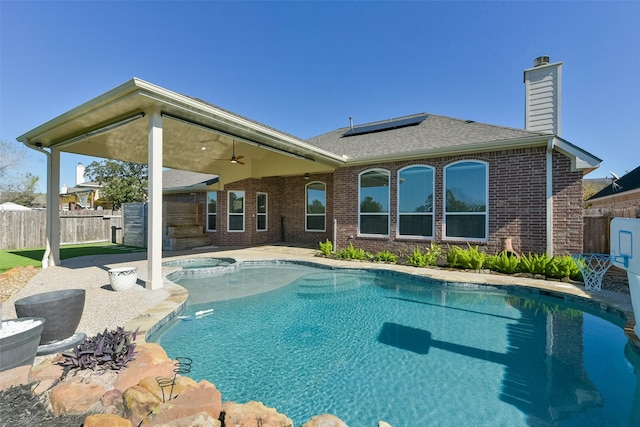 view of pool with ceiling fan and a patio area