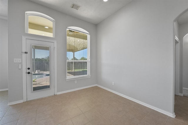 entryway featuring light tile patterned floors