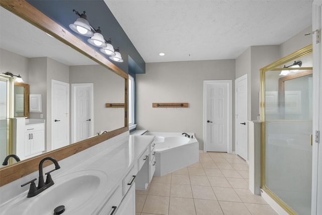 bathroom with tile patterned flooring, a textured ceiling, vanity, and plus walk in shower