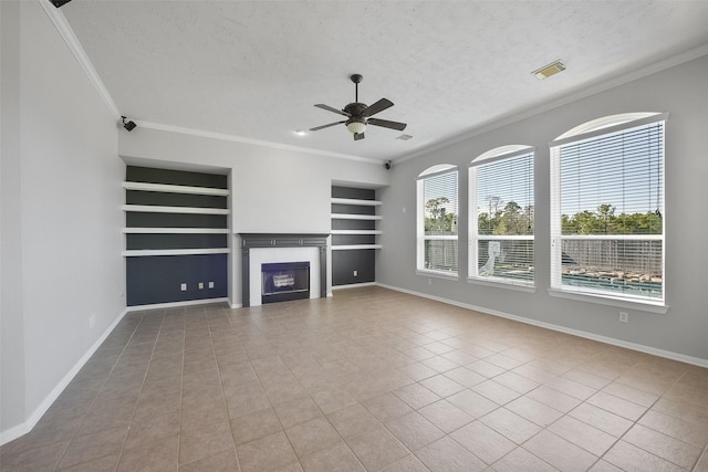 unfurnished living room featuring a textured ceiling, light tile patterned flooring, plenty of natural light, and built in shelves