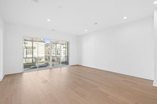 empty room with light hardwood / wood-style floors