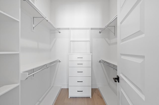 walk in closet featuring light wood-type flooring