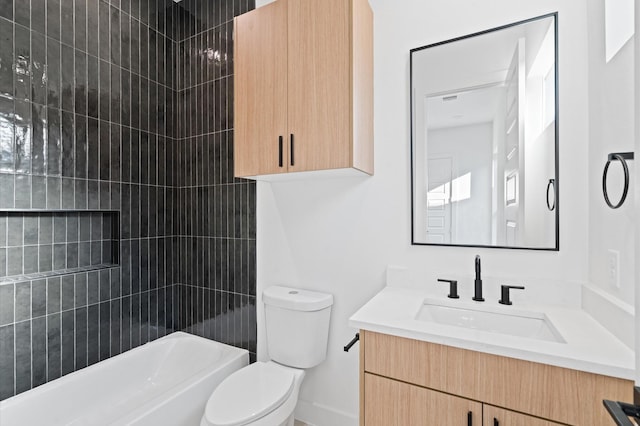 full bathroom with vanity, toilet, and tiled shower / bath combo