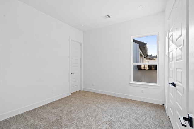 spare room featuring carpet floors