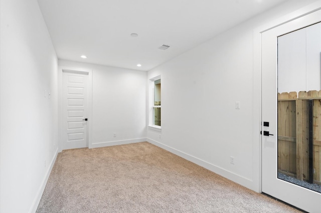 empty room with light colored carpet