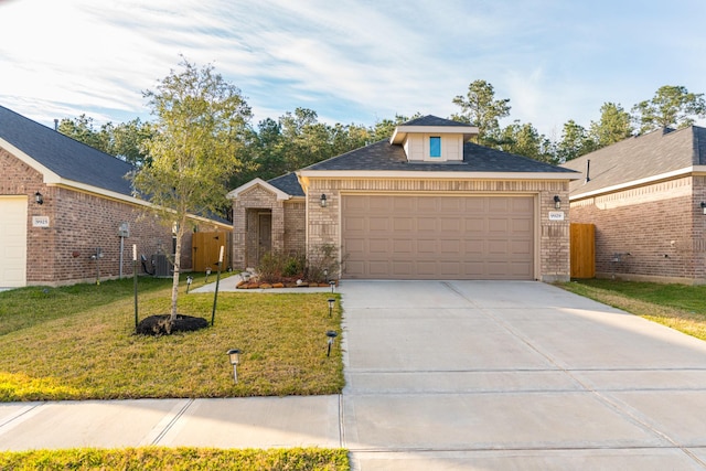 view of front of house featuring a garage and a front yard