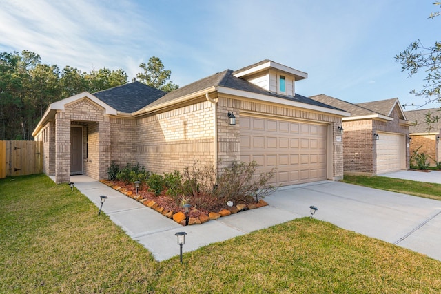 ranch-style home featuring a garage and a front lawn