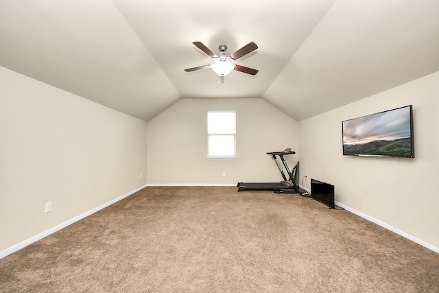 exercise room with carpet, ceiling fan, and lofted ceiling