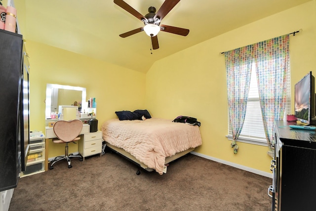 carpeted bedroom with ceiling fan and lofted ceiling