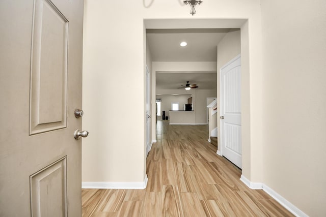 corridor with light wood-type flooring