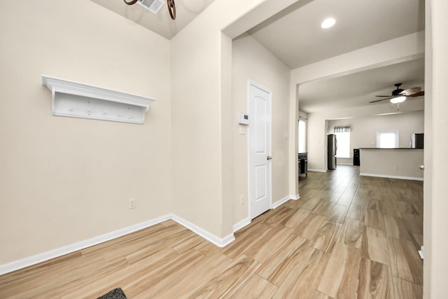 hallway with light wood-type flooring