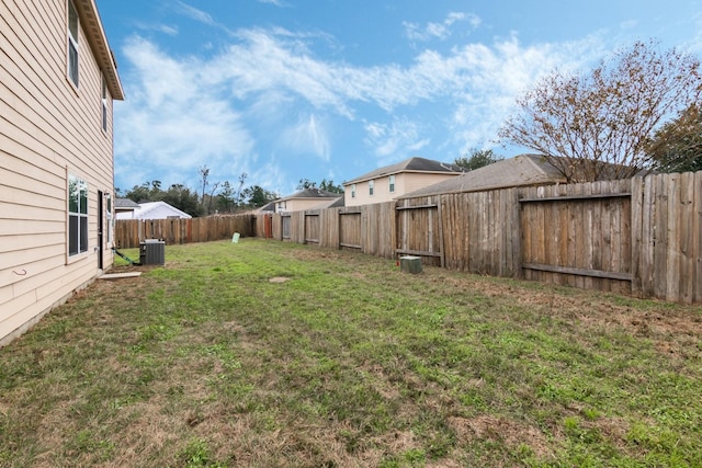 view of yard with central AC unit