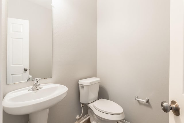 bathroom with toilet and sink