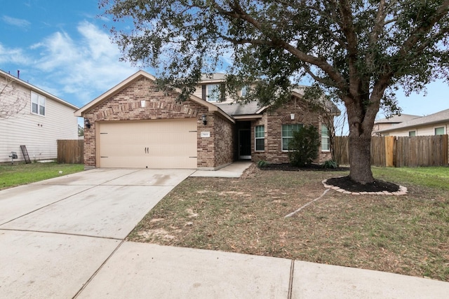 view of front facade with a garage and a front yard