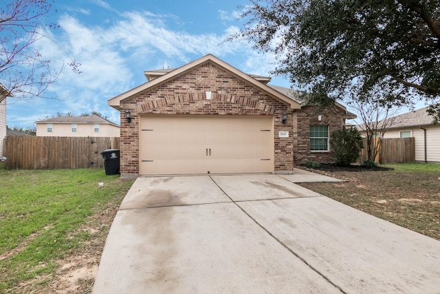 view of front of home with a garage and a front lawn