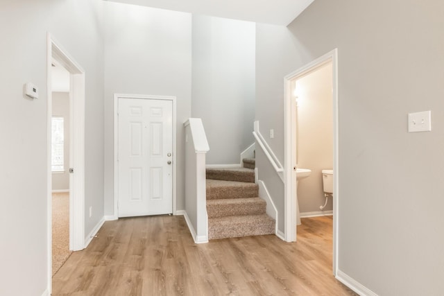 foyer entrance with light hardwood / wood-style floors