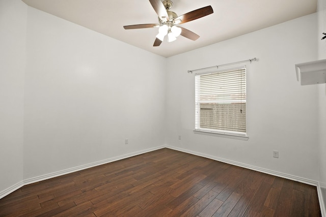 spare room with dark hardwood / wood-style floors and ceiling fan