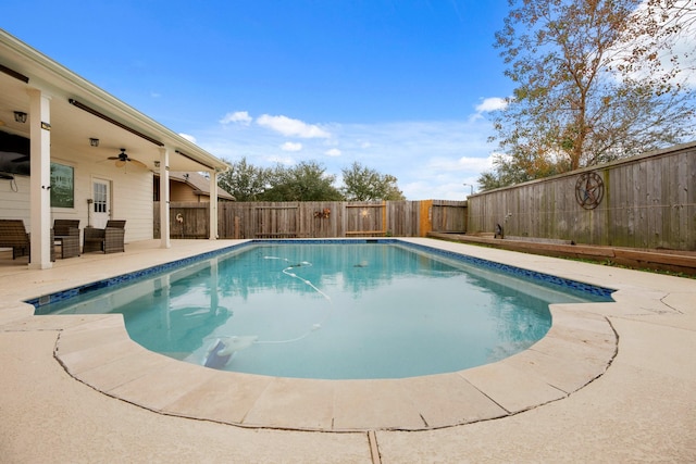 view of swimming pool with ceiling fan and a patio