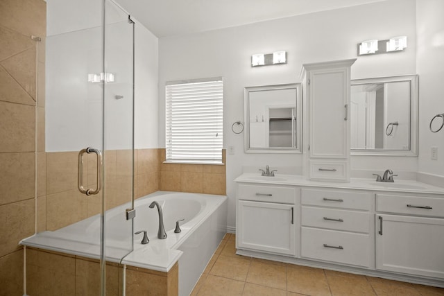 bathroom featuring separate shower and tub, tile patterned flooring, and vanity