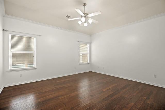 spare room with ceiling fan, dark hardwood / wood-style flooring, and ornamental molding