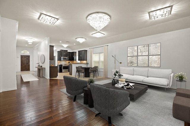 living room featuring dark wood-type flooring and a chandelier