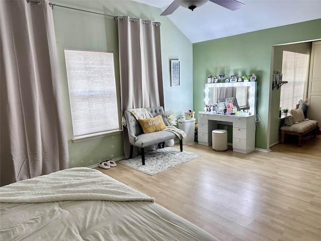 bedroom featuring ceiling fan, light hardwood / wood-style flooring, and vaulted ceiling