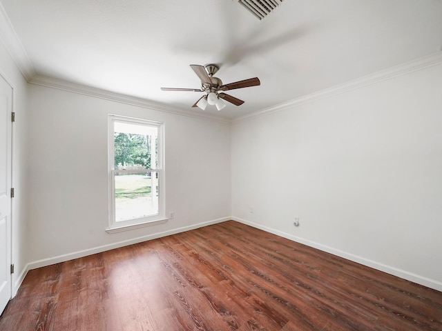 spare room with dark hardwood / wood-style floors, ceiling fan, and crown molding