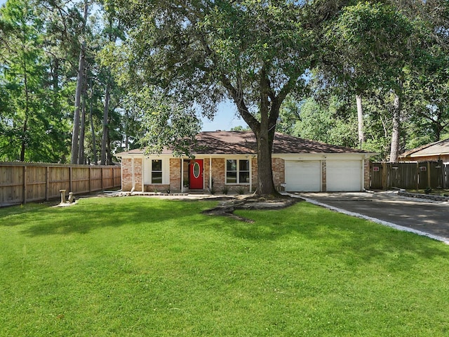 ranch-style house with a front lawn and a garage