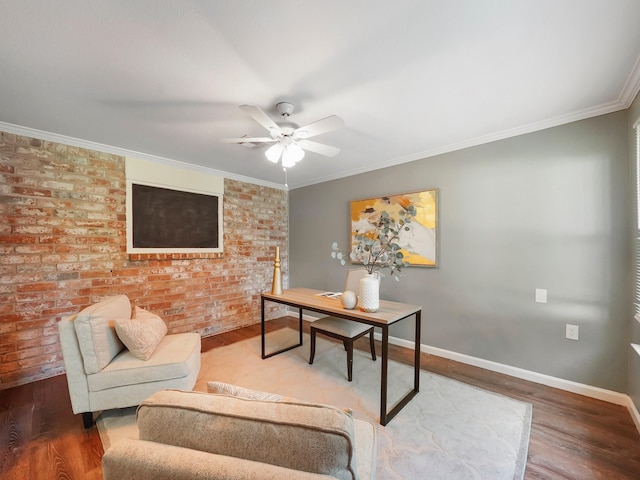 office featuring ceiling fan, wood-type flooring, and crown molding