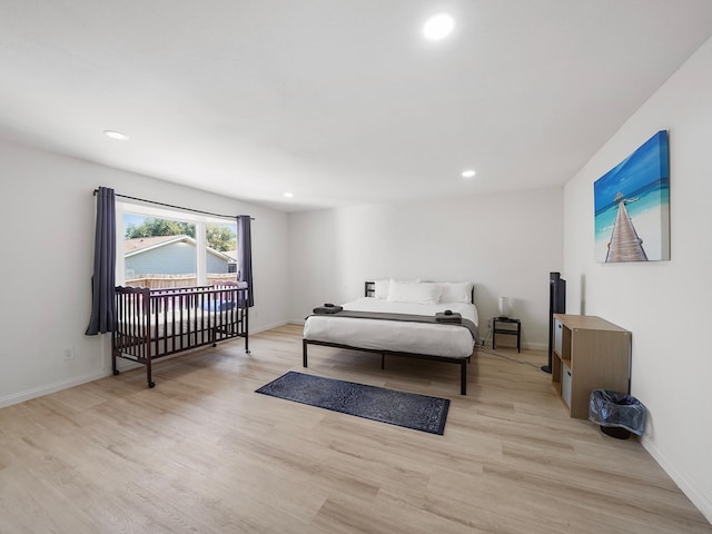 bedroom with light hardwood / wood-style floors