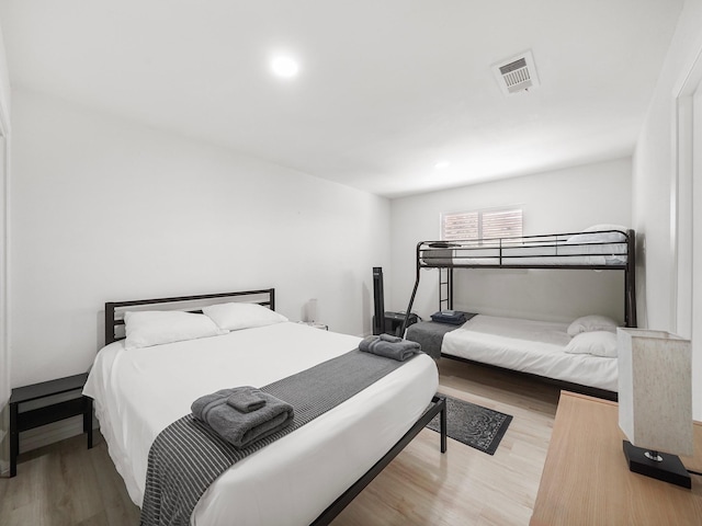 bedroom with light hardwood / wood-style floors